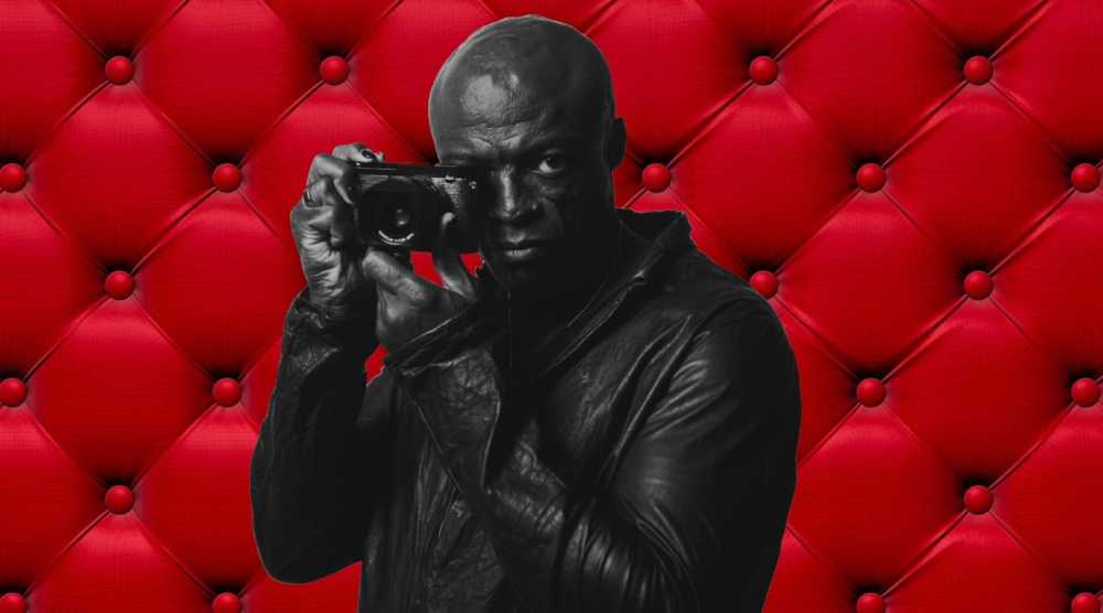 Le chanteur Seal prenant une photo avec un appareil Leica